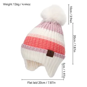 Striped winter knit hat for kids with large pompom and ear flaps in pink orange
