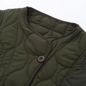 Army green round neck quilted jacket with contrast binding and wave stitching patterns