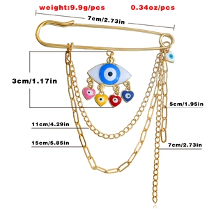 Detail view of evil eye brooch showing dimensions and weights of chains and pendants