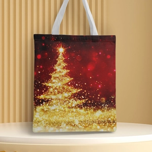 Close-up of golden Christmas tree print on high-quality red canvas tote bag fabric