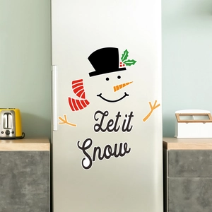 Close-up of Snowman and Let it Snow magnetic fridge stickers on a silver refrigerator