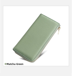 Close-up of Matcha Green leather wallet featuring textured litchi grain and gold zipper
