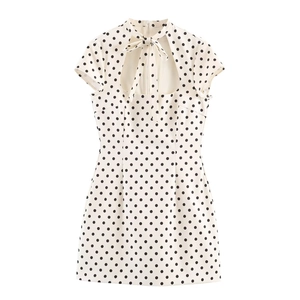Short white polka dot dress with high neck bow tie and hollow out design for women