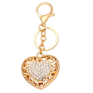 Elegant gold heart keychain with hollow pattern and sparkling crystal rhinestones for bags