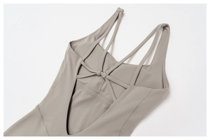 Detailed view of the criss-cross back straps on grey brushed yoga jumpsuit