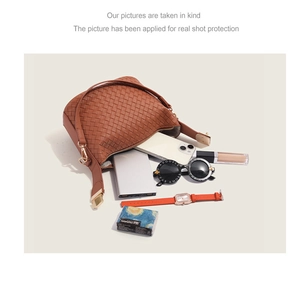Brown woven leather shoulder bag showing large interior capacity for daily essentials