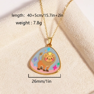 Detail of gold lion pendant necklace with blue enamel art on beige velvet background
