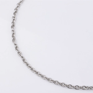 Macro view of polished silver stainless steel hip-hop style chain links on white background
