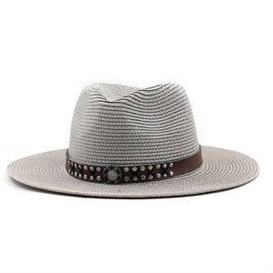 Detail of grey western straw hat featuring a brown leather band with silver metal studs