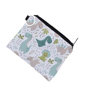 Detail view of cartoon dinosaur coin purse with waterproof material and metal keychain