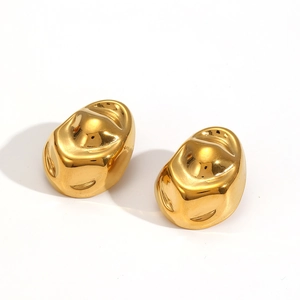 Macro view of gold plated stainless steel irregular crumpled bean earrings with shiny finish
