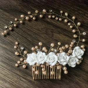 Detailed close-up of handmade bridal hair comb with ceramic flowers and champagne pearls