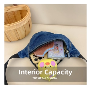 Detail view of denim belt bag interior showing storage space for phone and snacks