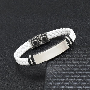 Detail of white braided leather bracelet with polished stainless steel plate and clasp