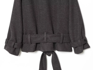 Close-up of the back hem and buckled cuff detail on a charcoal grey wool blend coat