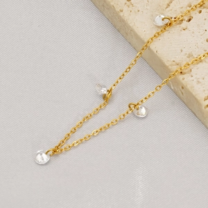 Elegant gold titanium bracelet with sparkling clear cubic zirconia crystals for women