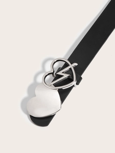 Close-up of heart-shaped silver buckle with lightning detail on black leather belt