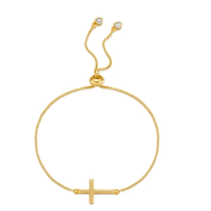 Detailed close-up of a gold-plated adjustable cross bracelet with heart-shaped zircon charms