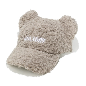 Detail of plush faux shearling baseball cap with cute bear ears and Holiday embroidery