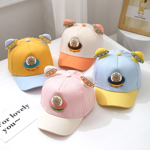 Detailed display of colorful cotton baby baseball caps with 3D cartoon bear UFO patches