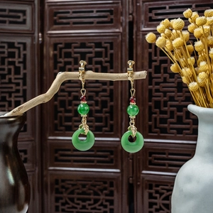 Detail of New Chinese style long tassel earrings with green jade beads and screw clips