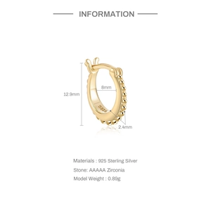 Detail view of S925 sterling silver gold earring with S925 hallmark and CZ stones