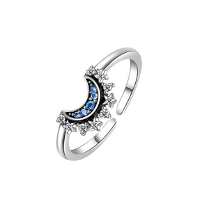 Detail of s925 silver adjustable ring featuring blue gems and moon-star motifs