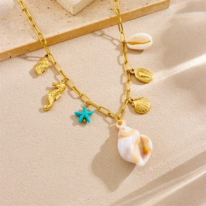 Golden stainless steel necklace featuring sea shell, seahorse, and starfish charms