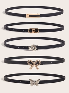 Set of five skinny black belts featuring various gold and silver decorative metal buckles