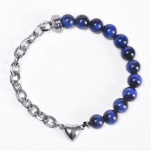 Detail view of heart magnetic clasp joining blue gemstone beads and silver chain link