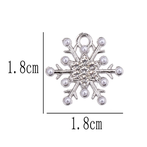 Sparkling snowflake pendant charm with inlaid pearls and rhinestones measuring 1.8cm