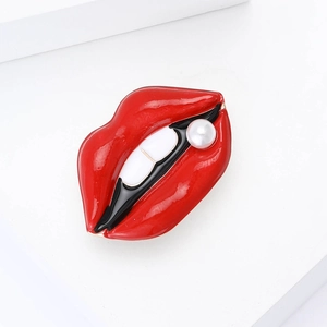 Creative enamel red lip brooch with white pearl detail for women on minimalist background