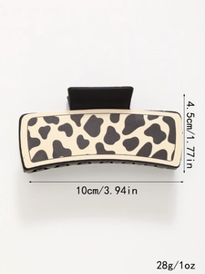 Detail view of large rectangular cow print hair claw clip with dimensions and matte finish