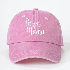 Detail of white Boy Mama embroidery with heart on a pink washed cotton baseball cap