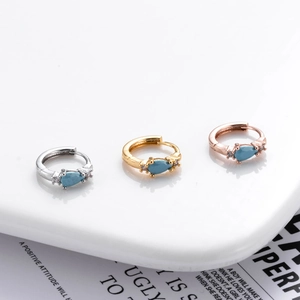 Three teardrop blue zircon earrings in silver, gold, and rose gold plating