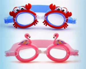 Close-up of kids swim goggles with red crab and pink flamingo cartoon frames