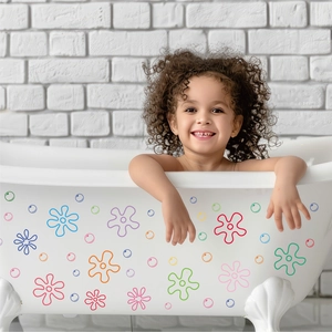Vibrant cartoon flower and bubble wall decals shown applied to a white bathtub surface.