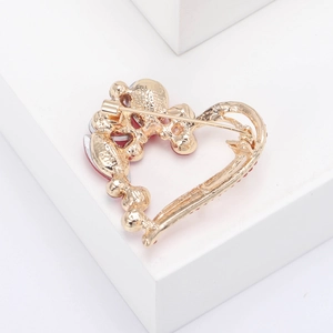 Detailed back view of heart brooch showing secure gold alloy pin fastener and structure