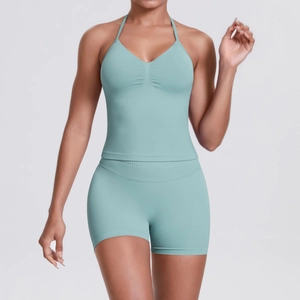 Close-up of light mint green seamless knit yoga set featuring ribbed texture and V-neck