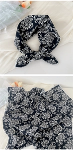 Detail of black cotton linen small scarf with white print showing tied and flat layout
