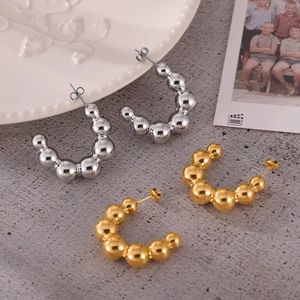 Minimalist C-shaped titanium bubble hoop earrings in gold and silver polished metal beads
