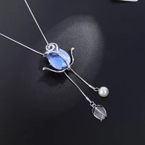 Detailed view of silver tulip necklace with blue crystal and elegant white pearl pendant
