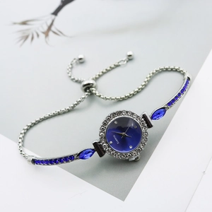 Elegant silver quartz watch with blue dial and adjustable zirconia bracelet for women