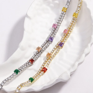 Close-up of dual-layer colorful zircon tennis bracelets in gold and silver plating