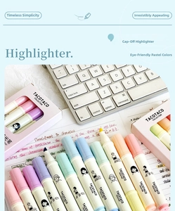 Pastel highlighters scattered on a white keyboard and notes for student study desk aesthetics