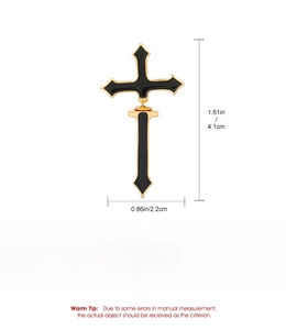 Macro shot of Gothic black and gold cross earrings with precise size dimensions