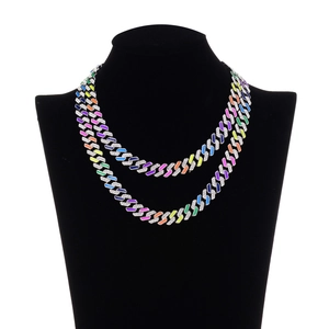 Close-up of rainbow double-layer Cuban chain necklace with rhinestones on black bust