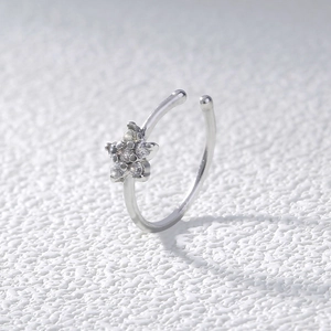 Silver stainless steel star nose ring featuring sparkling clear cubic zirconia stones