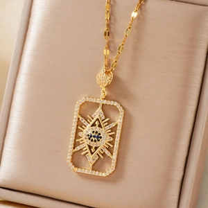 Gold geometric rectangle Evil Eye necklace with blue zircon in a champagne jewelry box