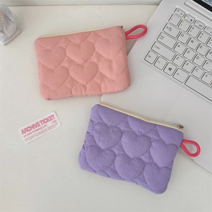 Pink and purple quilted mini pouches with heart patterns and handy wristlet straps